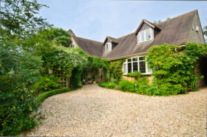 Single storey cottage with stone pathway