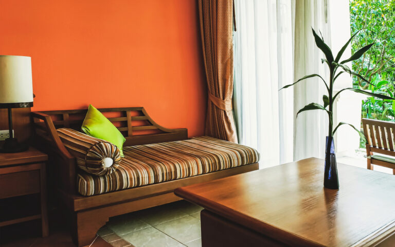 couch with orange background