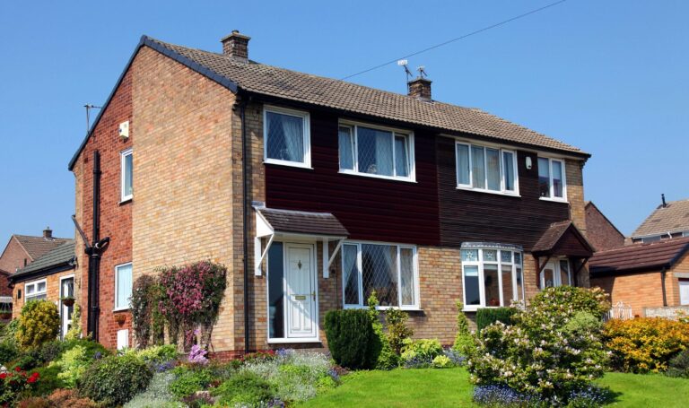 Semi-detached brick house in the UK commuter belt, ideal for family buyers seeking homes.