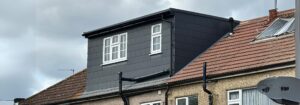 Modern dormer loft conversion built onto a residential roof