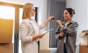 Letting agent handing keys to a tenant in a Hertfordshire rental property as landlords prepare for the Renters’ Rights Act and Section 21 abolition