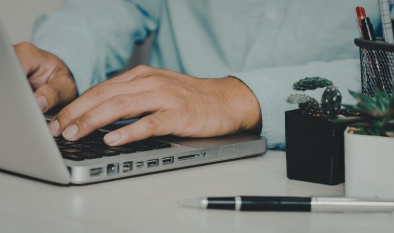 Landlord reviewing tenant affordability and referencing on laptop