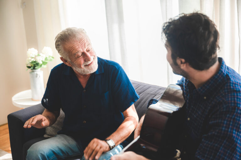 Landlord and tenant having friendly conversation in living room setting