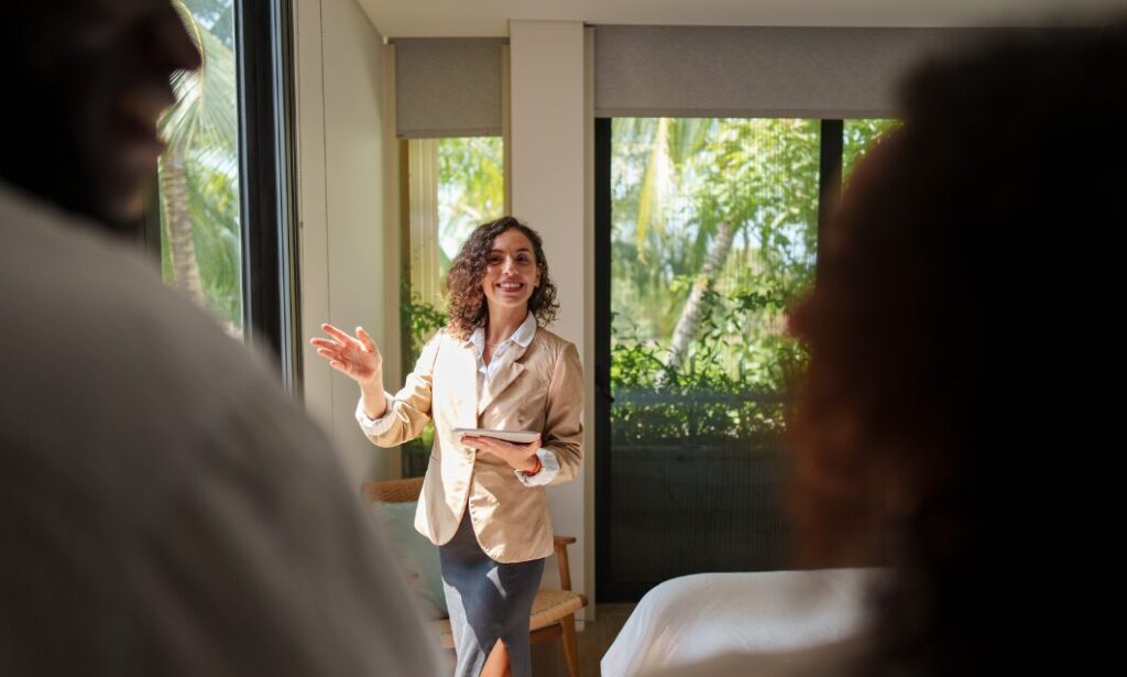 Letting agent presenting a rental property to prospective tenants during a viewing