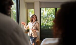 Letting agent presenting a rental property to prospective tenants during a viewing