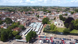 Aerial view of Hitchin town centre and residential areas near the railway station
