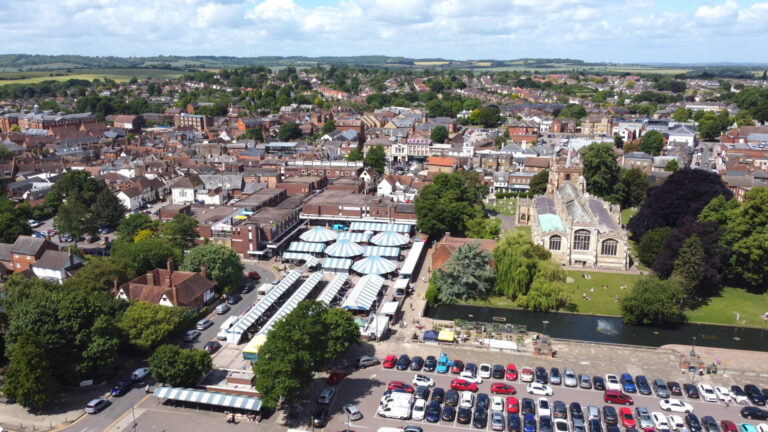 Aerial view of Hitchin town centre and residential areas near the railway station