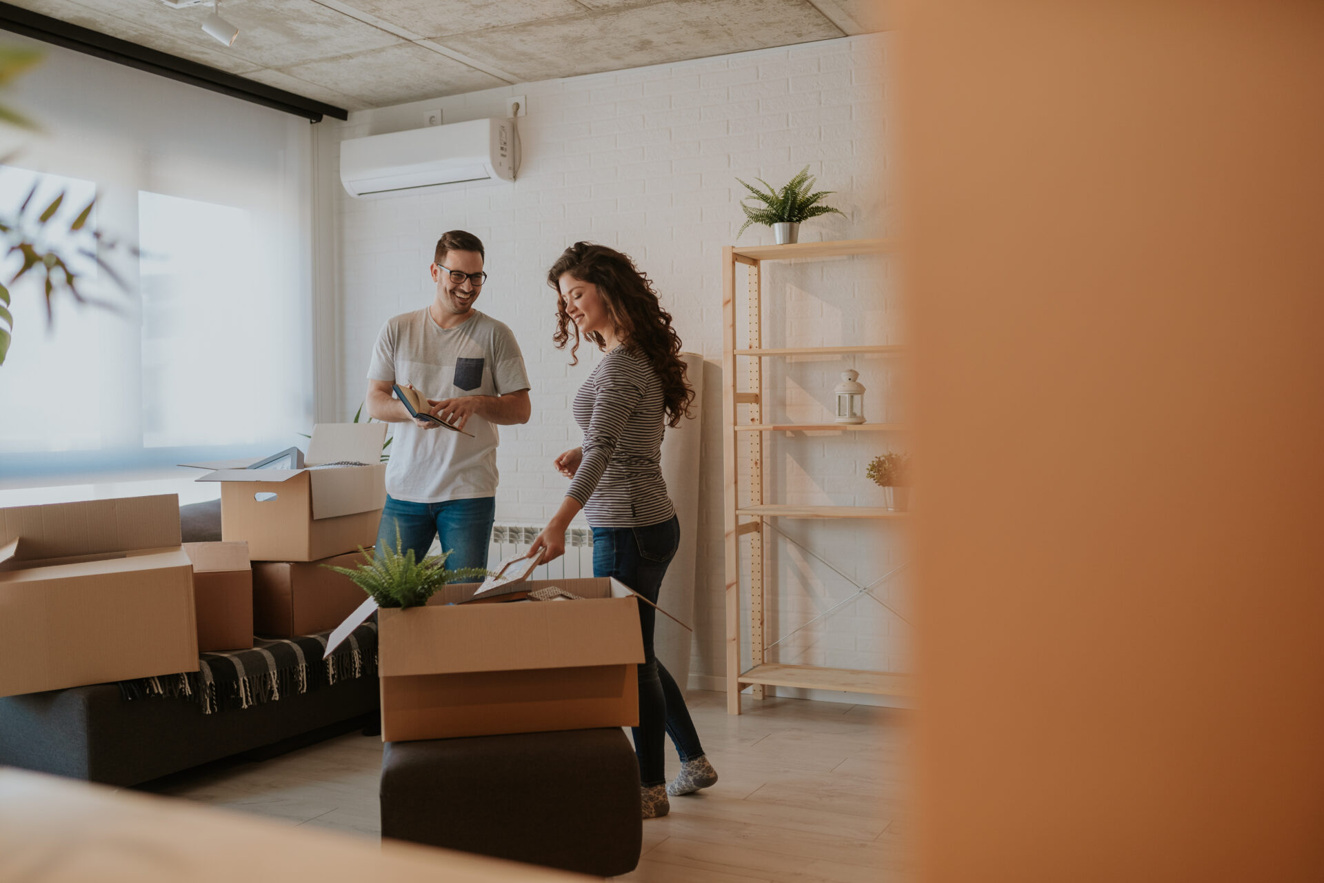 Couple moving into a home, representing living in Letchworth Garden City SG6.