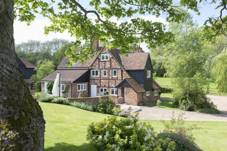 English countryside home with a lush green lawn