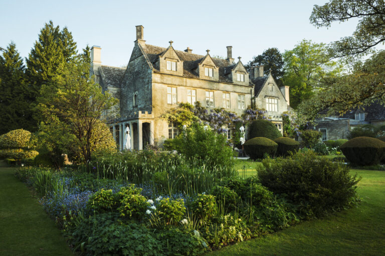 Grand country home with an expansive landscaped garden and lawn