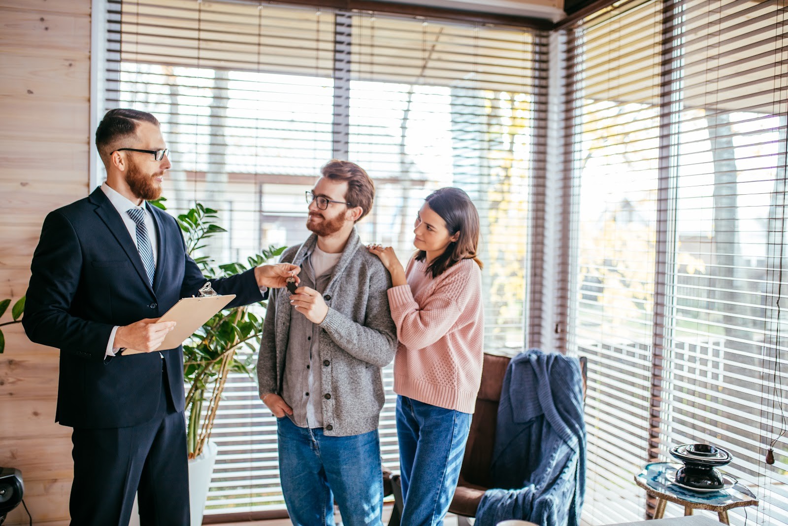 Estate agent handing keys to buyers at a home in Hitchin, Hertfordshire